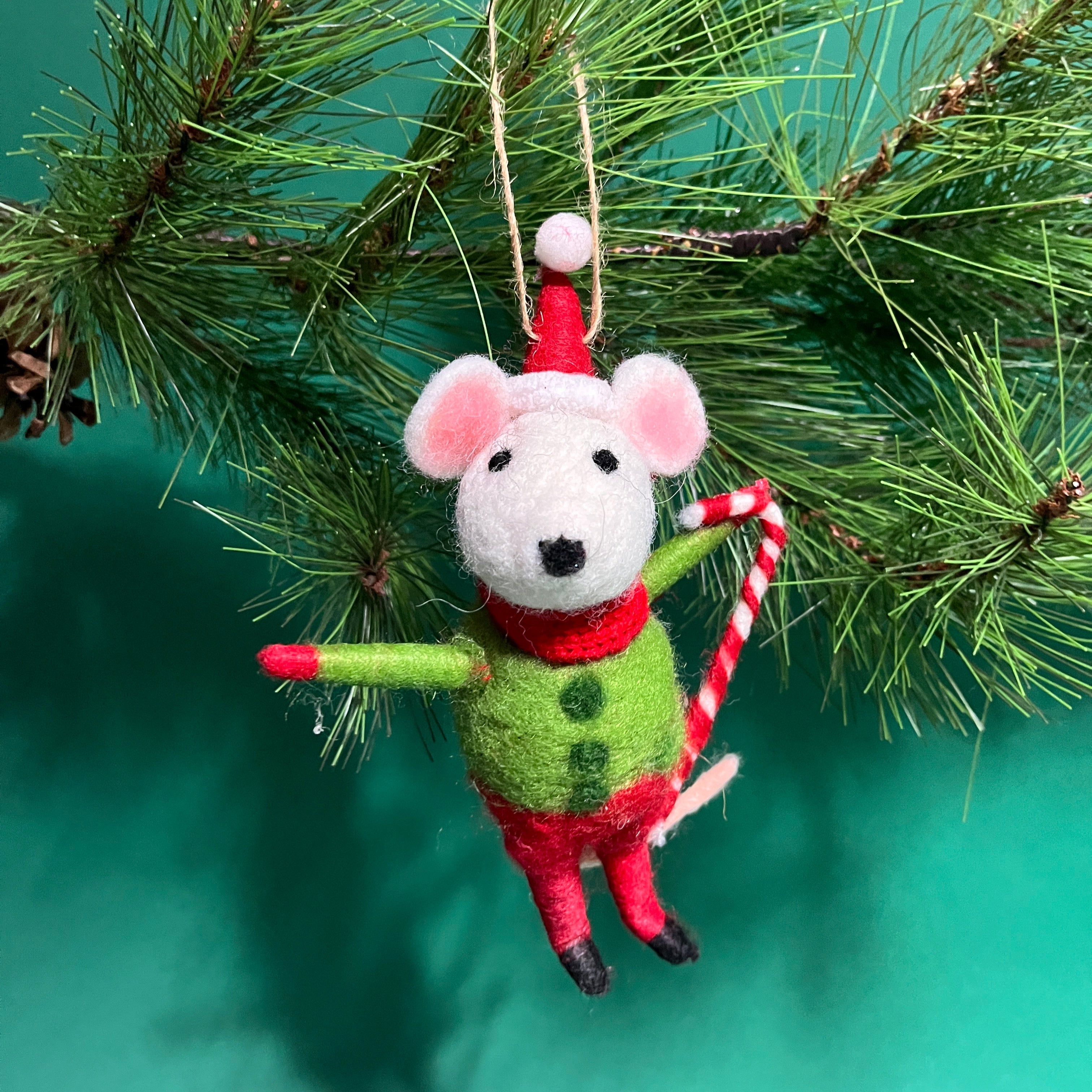 A festive felt mouse ornament dressed in red and green, holding a candy cane