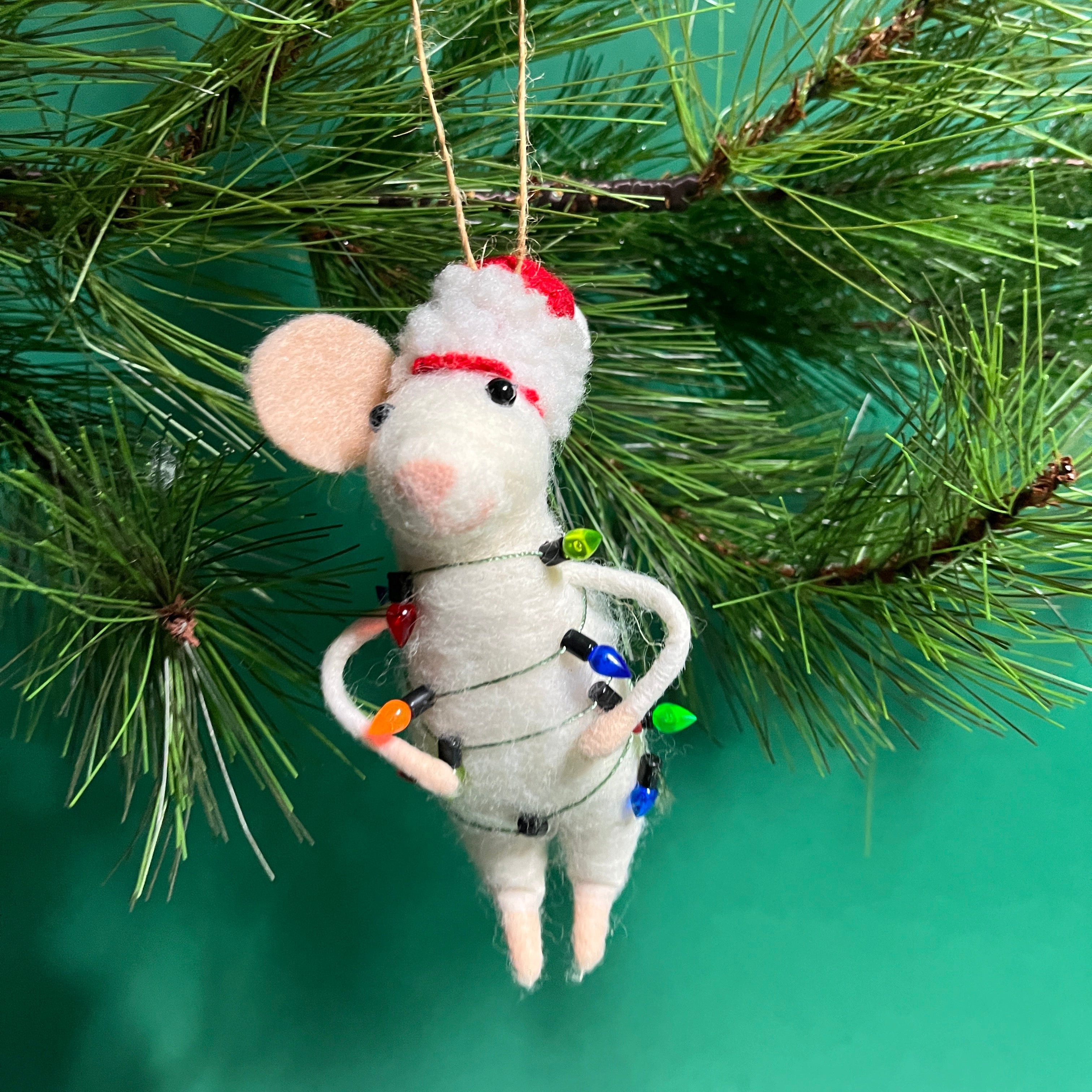 white felt mouse ornament wrapped in colorful holiday lights
