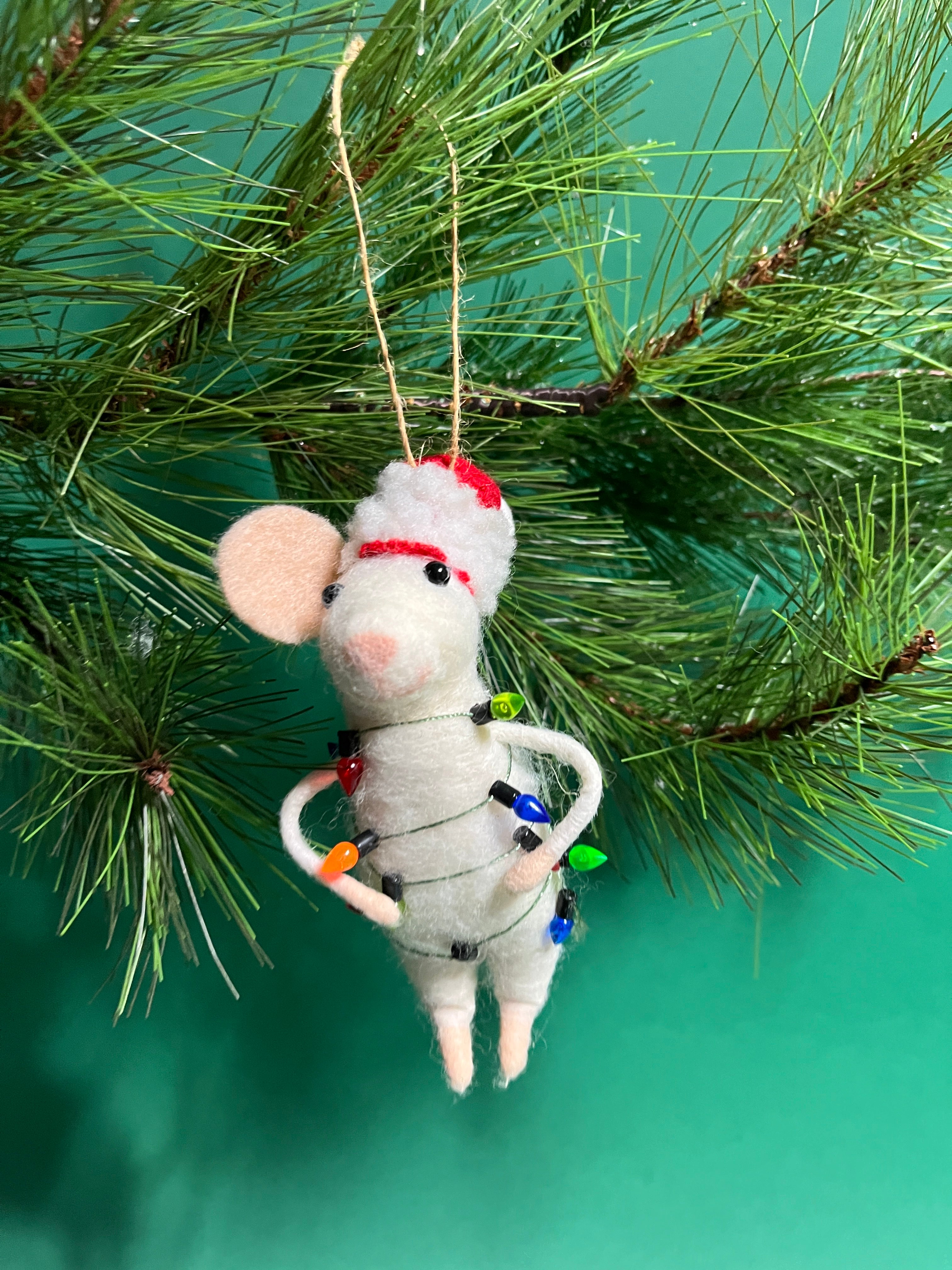 white felt mouse ornament wrapped in colorful holiday lights