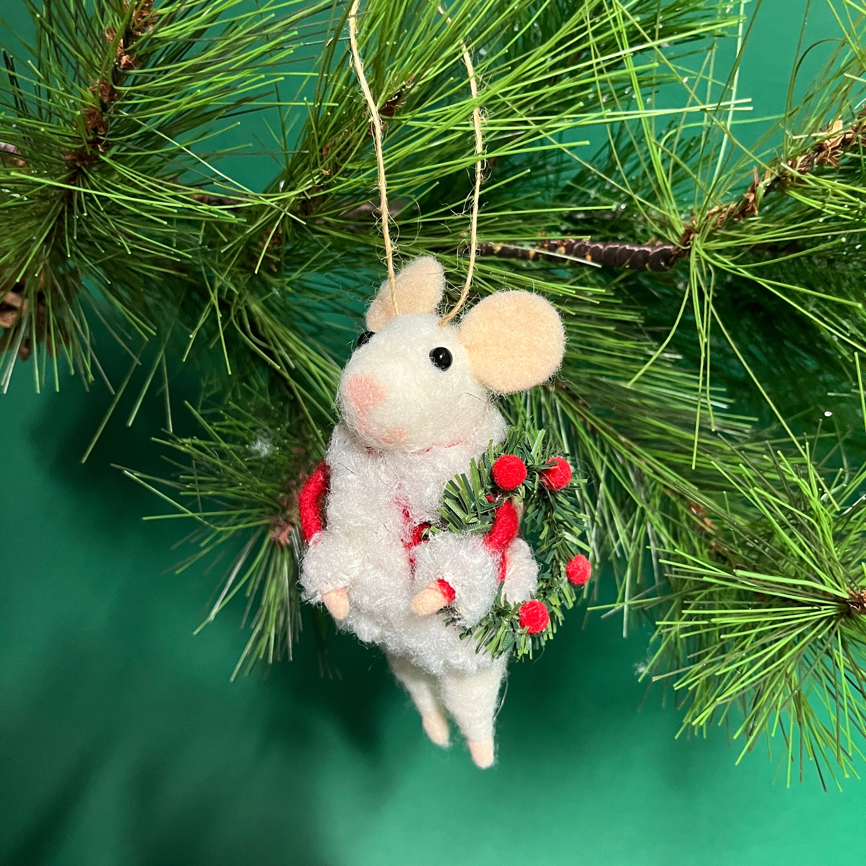 white felt mouse ornament dressed in cozy winter outfits, holding a Christmas wreath