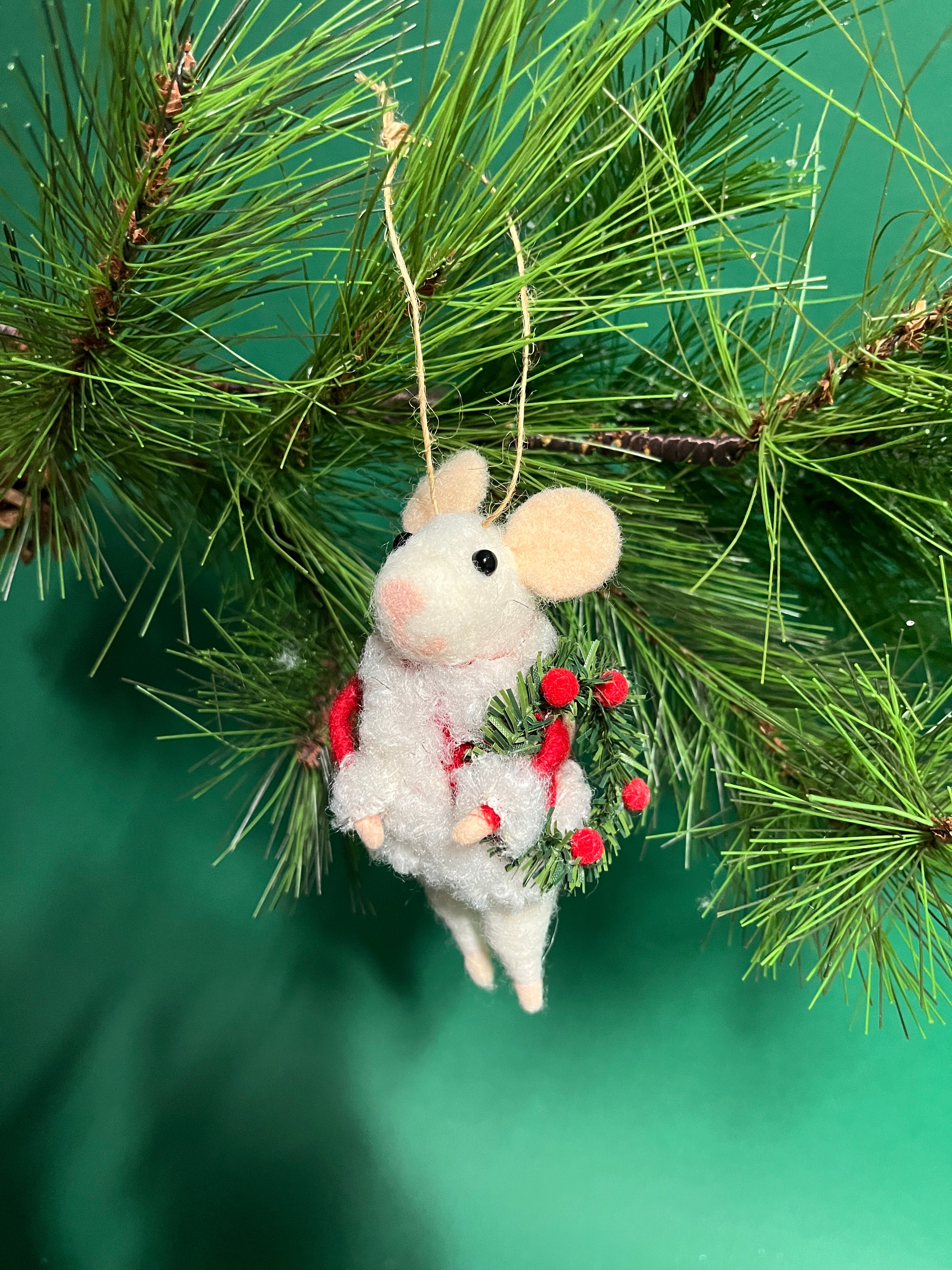 white felt mouse ornament dressed in cozy winter outfits, holding a Christmas wreath