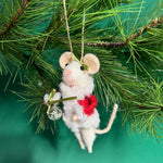 white felt mouse ornament dressed in cozy winter outfit and holding a festive ornament