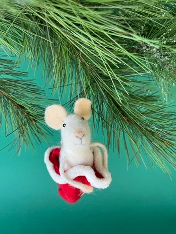 one felt mouse ornament sitting inside a red Christmas stocking with white trim.