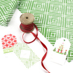 a wrapping paper with a geometric lattice pattern in green
