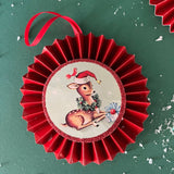 retro-style ruffled paper Christmas ornaments featuring vintage illustration, accented with red pleated borders and hanging ribbons