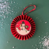 retro-style ruffled paper Christmas ornaments featuring vintage illustration, accented with red pleated borders and hanging ribbons