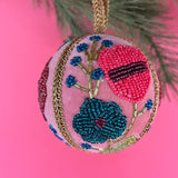 velvet Christmas ball ornaments beautifully hand-embroidered with beaded floral designs and finished with gold braided trim and hanging loops