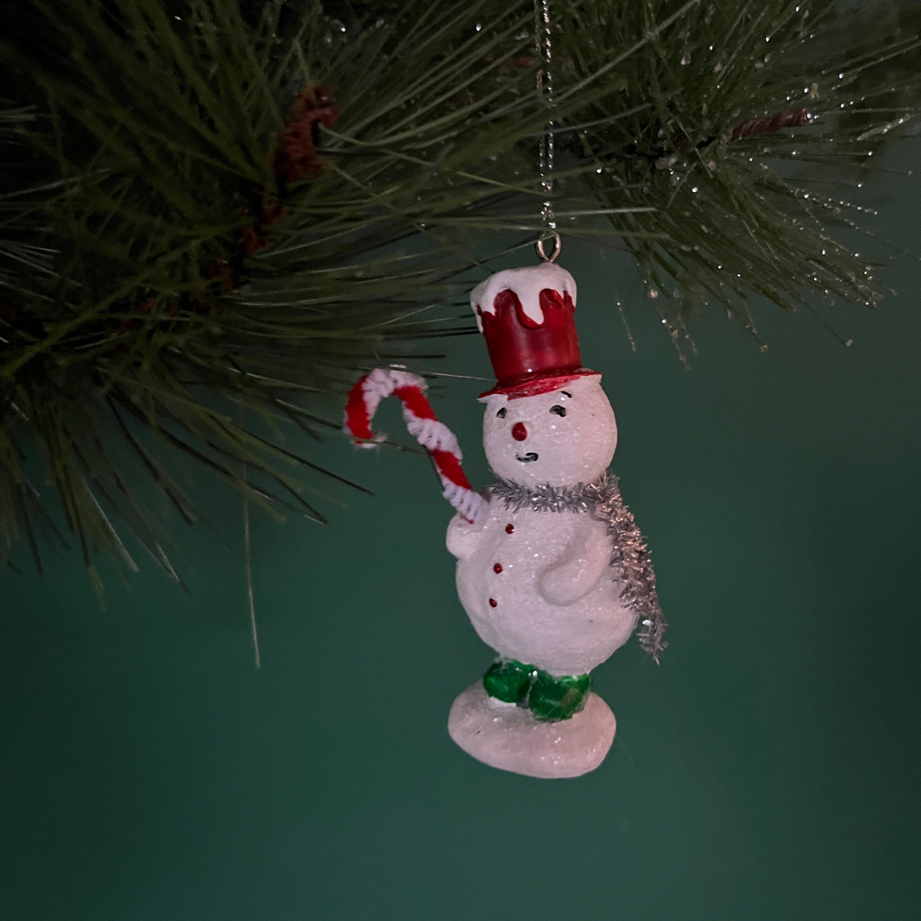 vintage-style snowman ornaments, wearing a colorful top hat and scarf