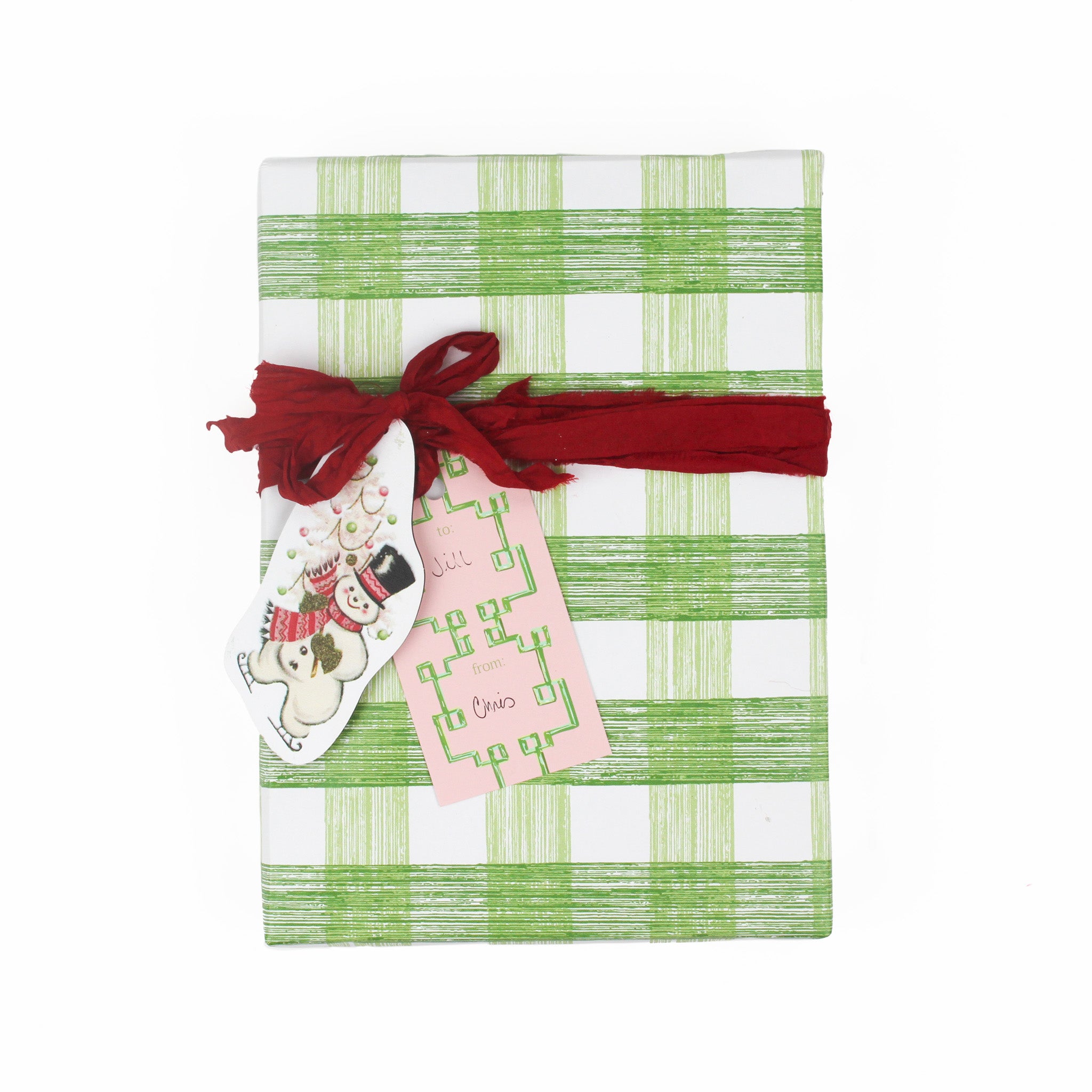 a gift tag with bamboozled pattern in pink with a space for personal message attached on a wrapped present
