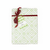 A green gingham patterned gift tags with a white space for personalized message, attached in a wrapped present