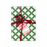 A red gingham patterned gift tags with a white space for personalized message, attached on a wrapped present