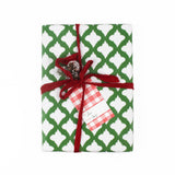 A red gingham patterned gift tags with a white space for personalized message, attached on a wrapped present