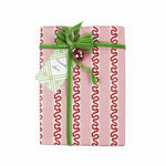 a gift tag with a geometric lattice pattern in green, added to a wrapped present