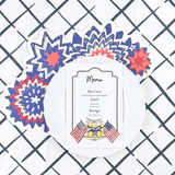 Menu card with patriotic design on a white plate against a checkered background