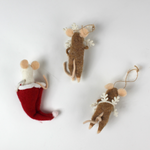 back of the Three felt mouse ornaments, one peeking out of a red Christmas stocking and two wearing white snowflake costume frames, shown lying flat