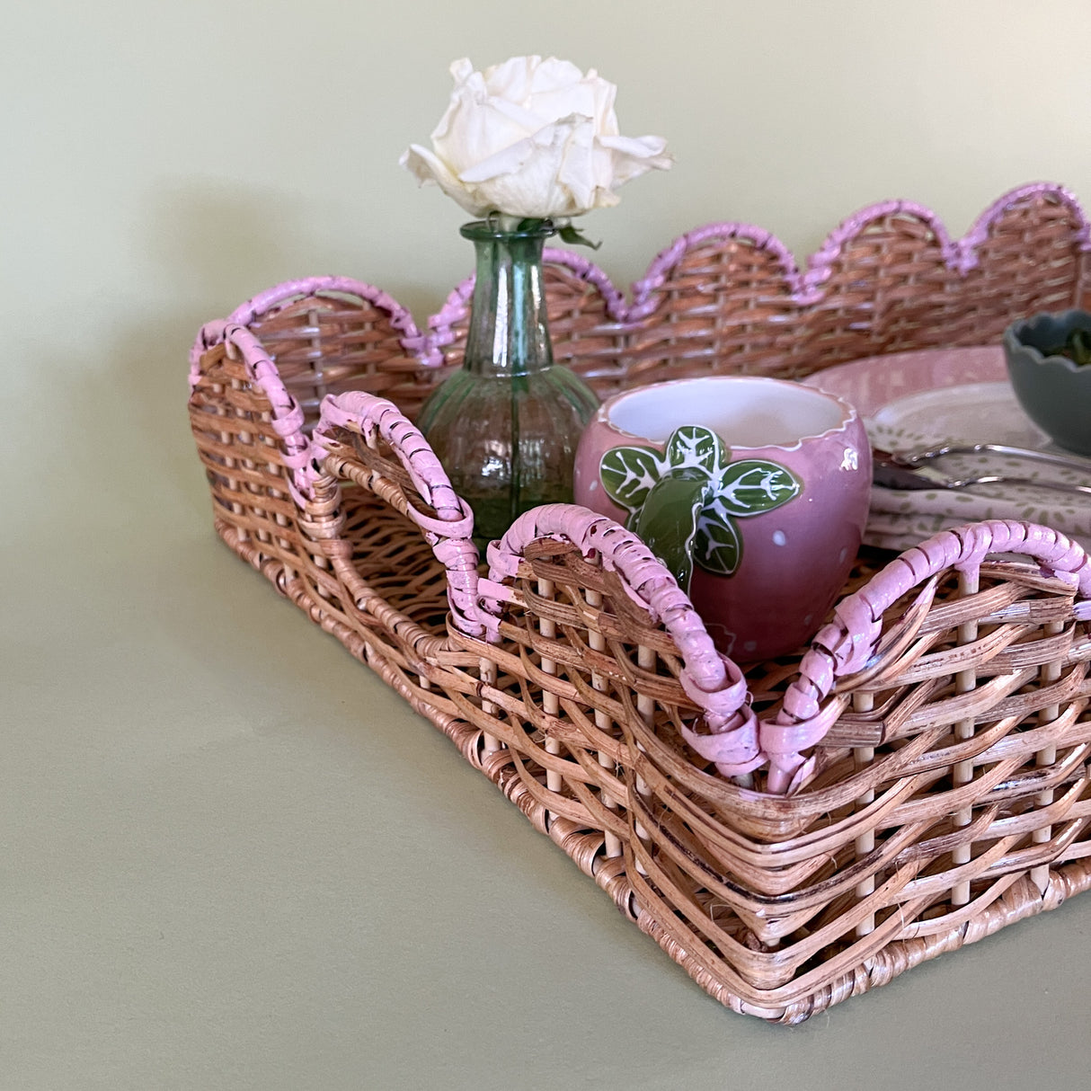 syled rattan tray with plate, mug, bud vase upclose detail