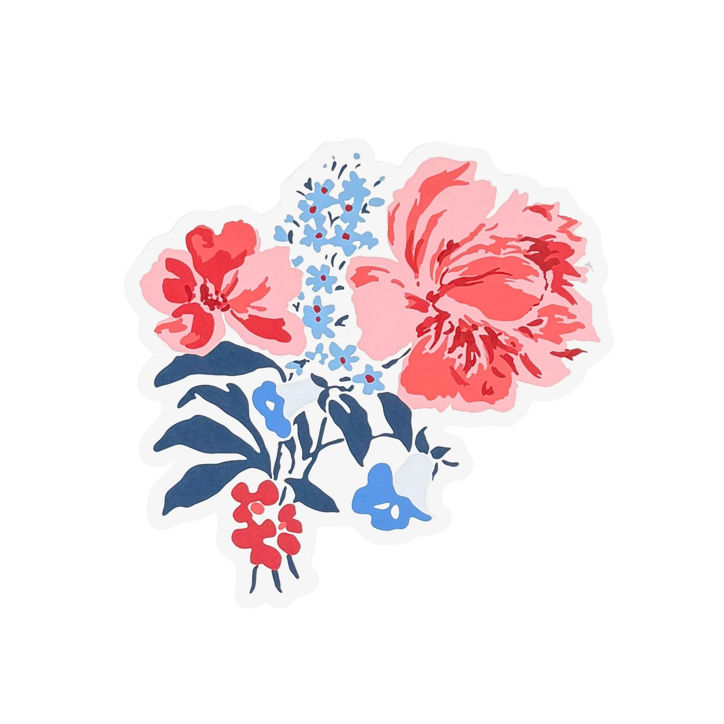 A die cut floral paper placemat featuring pink red and blue flowers with navy leaves on a white background.