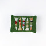 Rectangular green decorative pillow with a hooked texture, featuring a colorful pattern of golf tees in white, red, blue, yellow, and peach tones.