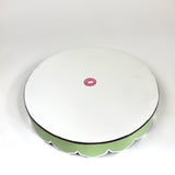 The plain white reverse side of Temple Garden, a tole metal tray with scalloped edges in green with a pink and green chinoiserie peony blossom pattern