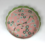 An aerial view of Temple Garden, a tole metal tray with scalloped edges in green with a pink and green chinoiserie peony blossom pattern