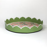Temple Garden, a tole metal tray with scalloped edges in green with a pink and green chinoiserie peony blossom pattern