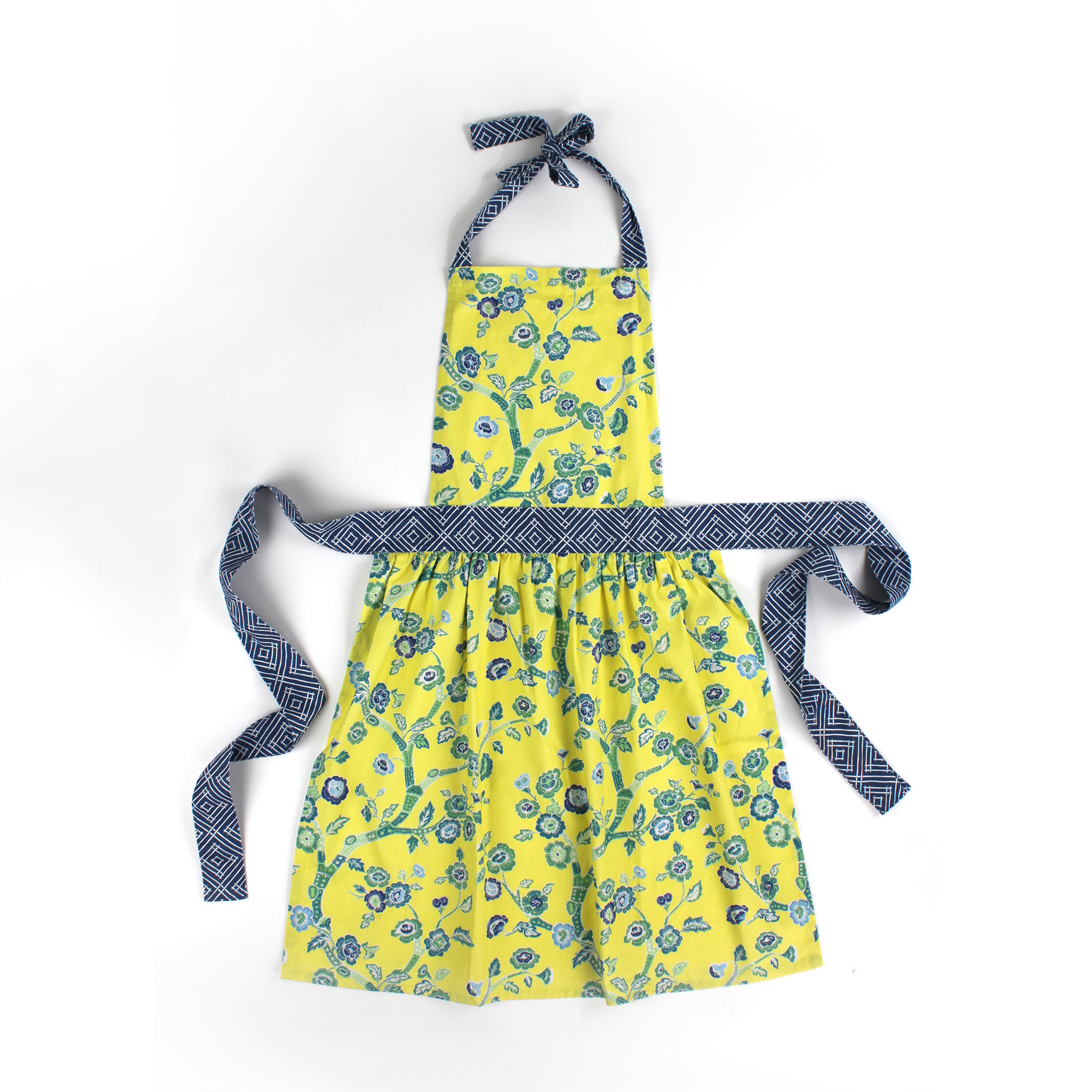 Yellow apron with blue floral chinoiserie pattern on a white background