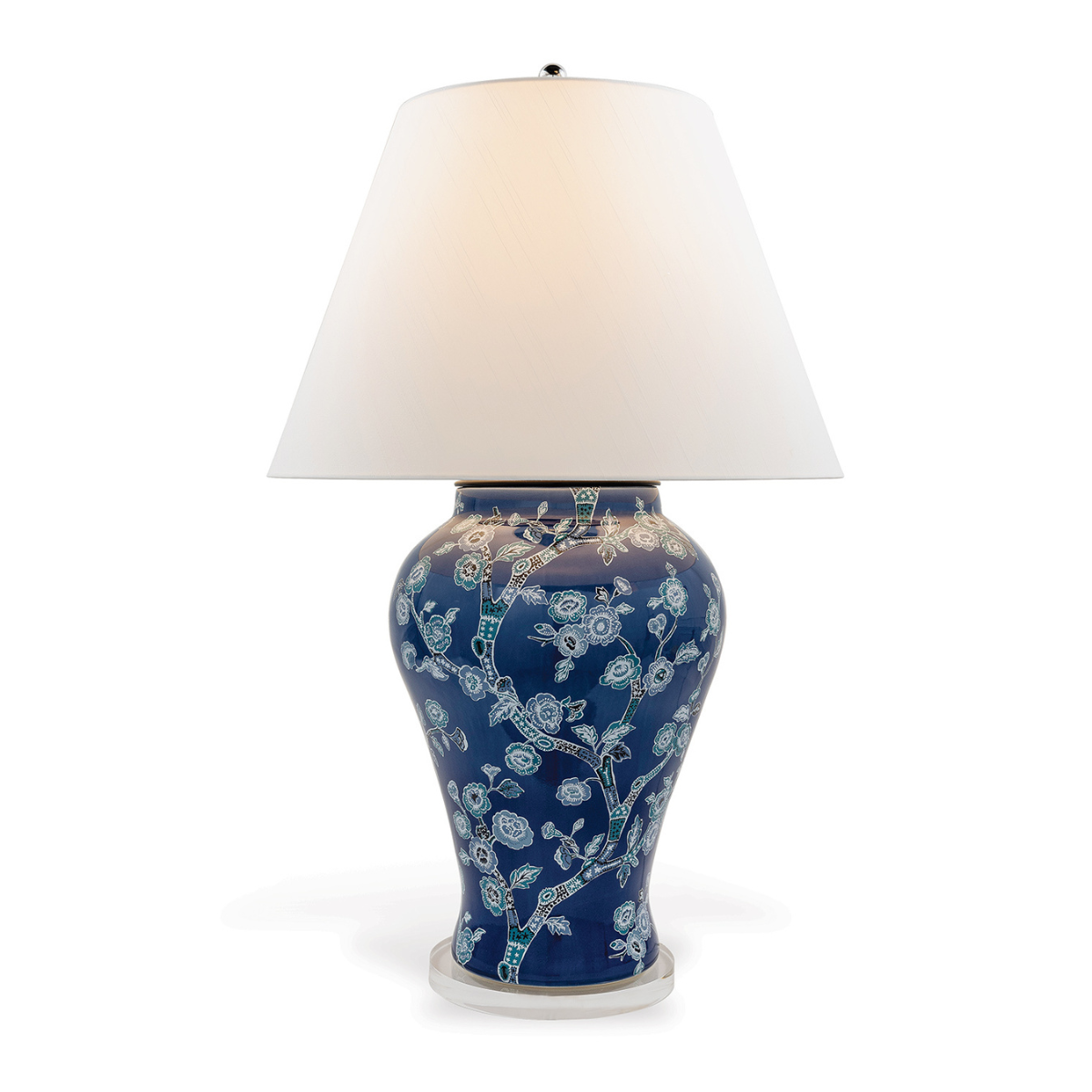 A blue and white table lamp featuring a blue and white chinoiserie lamp base and a white lampshade.