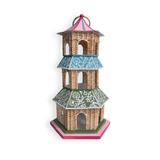 A decorative miniature pagoda with three tiers, featuring a natural rattan body, teal and green patterned roofs, and pink accents on the top and base, shown against a plain white background.