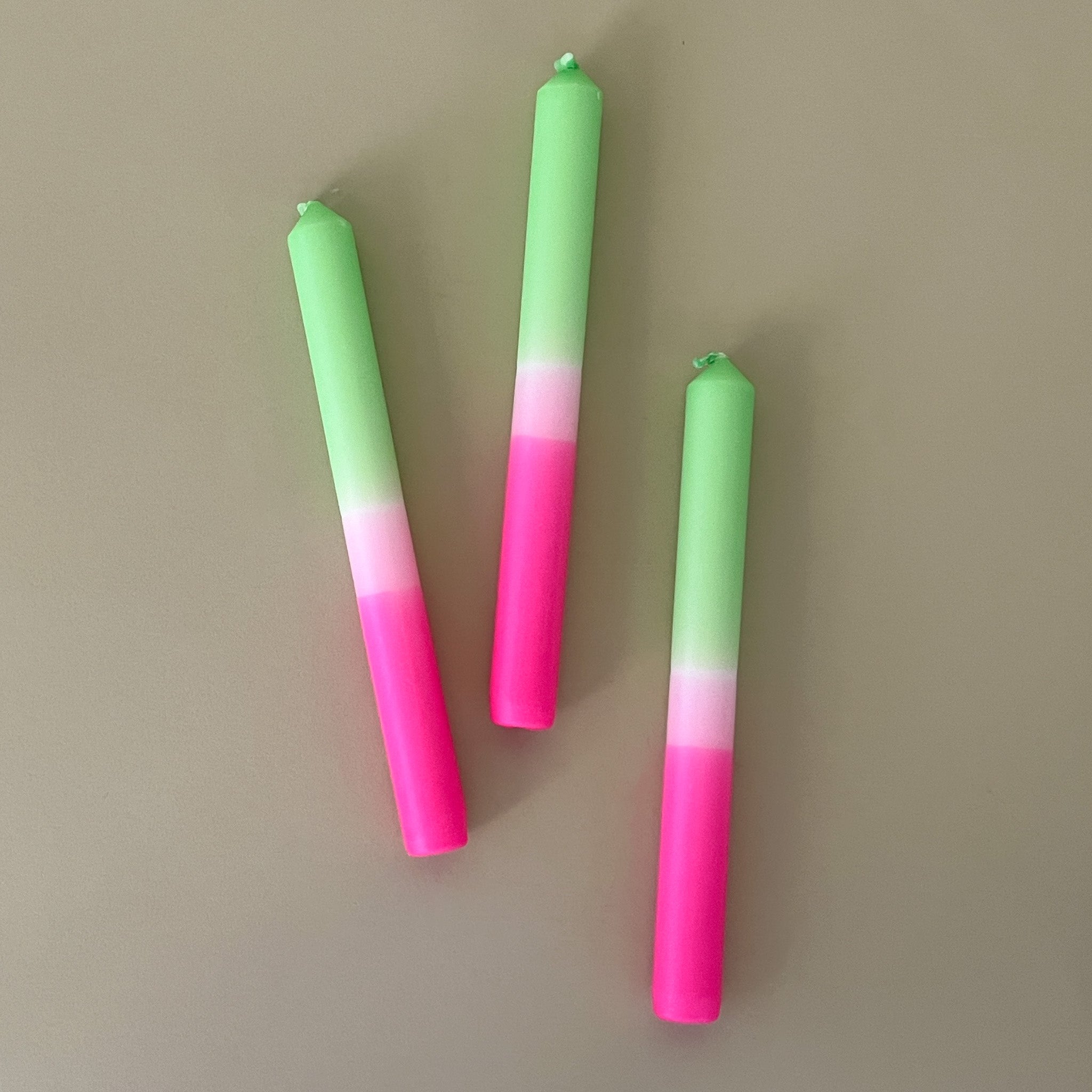 three pink and green spring taper candles