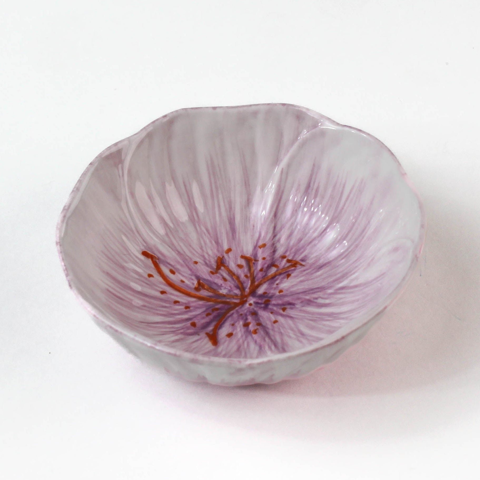  purple flower shaped bowl on a white background