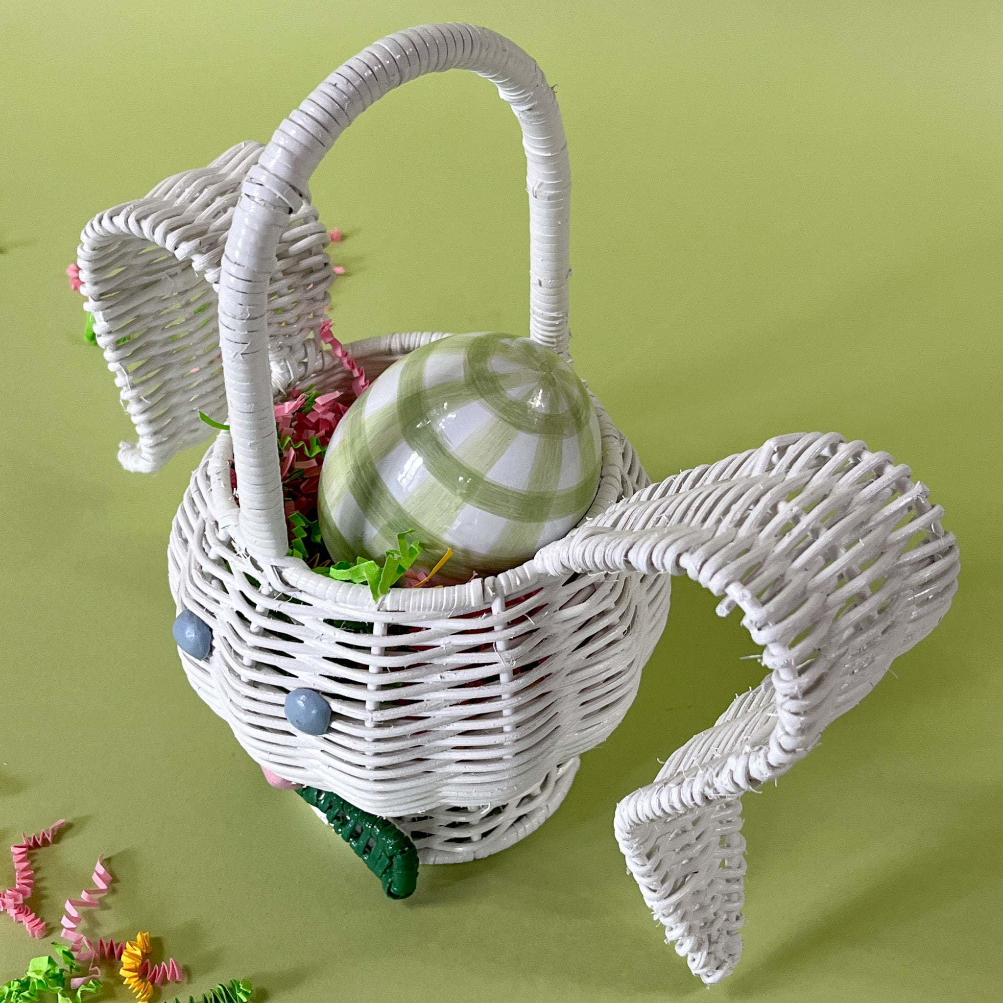 white rattan bunny easter basket with egg in it top view