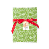 Elegant gift wrap featuring delicate white floral patterns on a vibrant green background for beautiful presents.