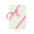 Elegant gift wrap featuring delicate green floral patterns on white paper, perfect for thoughtful gifting.