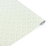 Elegant gift wrap featuring delicate green floral patterns on white paper, perfect for thoughtful gifting.