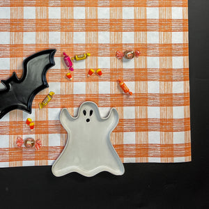 a gingham orange paper table runner in a pattern called gin lane by madcap cottage