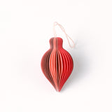 Close-up of pink folded paper Christmas ornaments in assorted bulb and teardrop shapes with hanging strings
