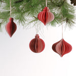Set of folded paper pink Christmas ornaments in assorted bulb shapes with hanging string