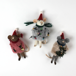 Three festive felt mouse ornaments dressed in fuzzy holiday outfits and Santa hats, holding Christmas decorations like string lights, a wreath, and a gold bell.