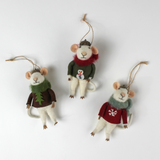 Three felt mouse ornaments wearing cozy sweaters with festive designs—a snowman, a tree, and a snowflake—each topped with a tiny acorn cap and ready to hang.
