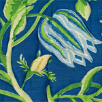Blue floral upholstered loveseat with botanical pattern and rolled arms