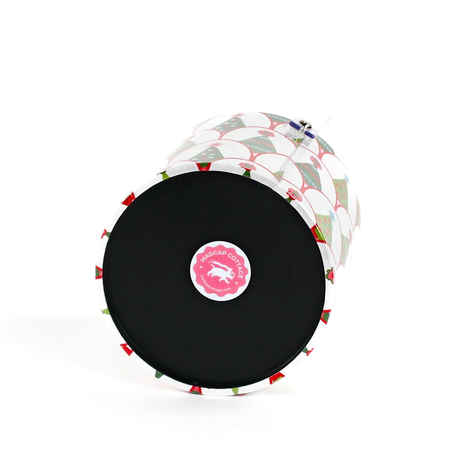 showing the bottom of a Twinkle Trees acrylic ice bucket covered in a green Christmas tree pattern.