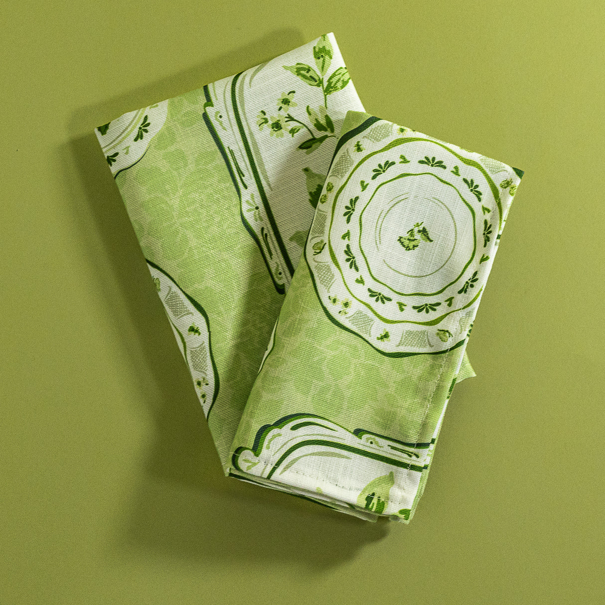a pair of green vintage plates fabric napkins