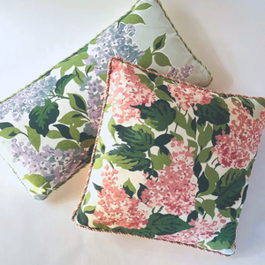 a square throw pillow and a rectangular throw pillow made from hydrangea print fabric. 