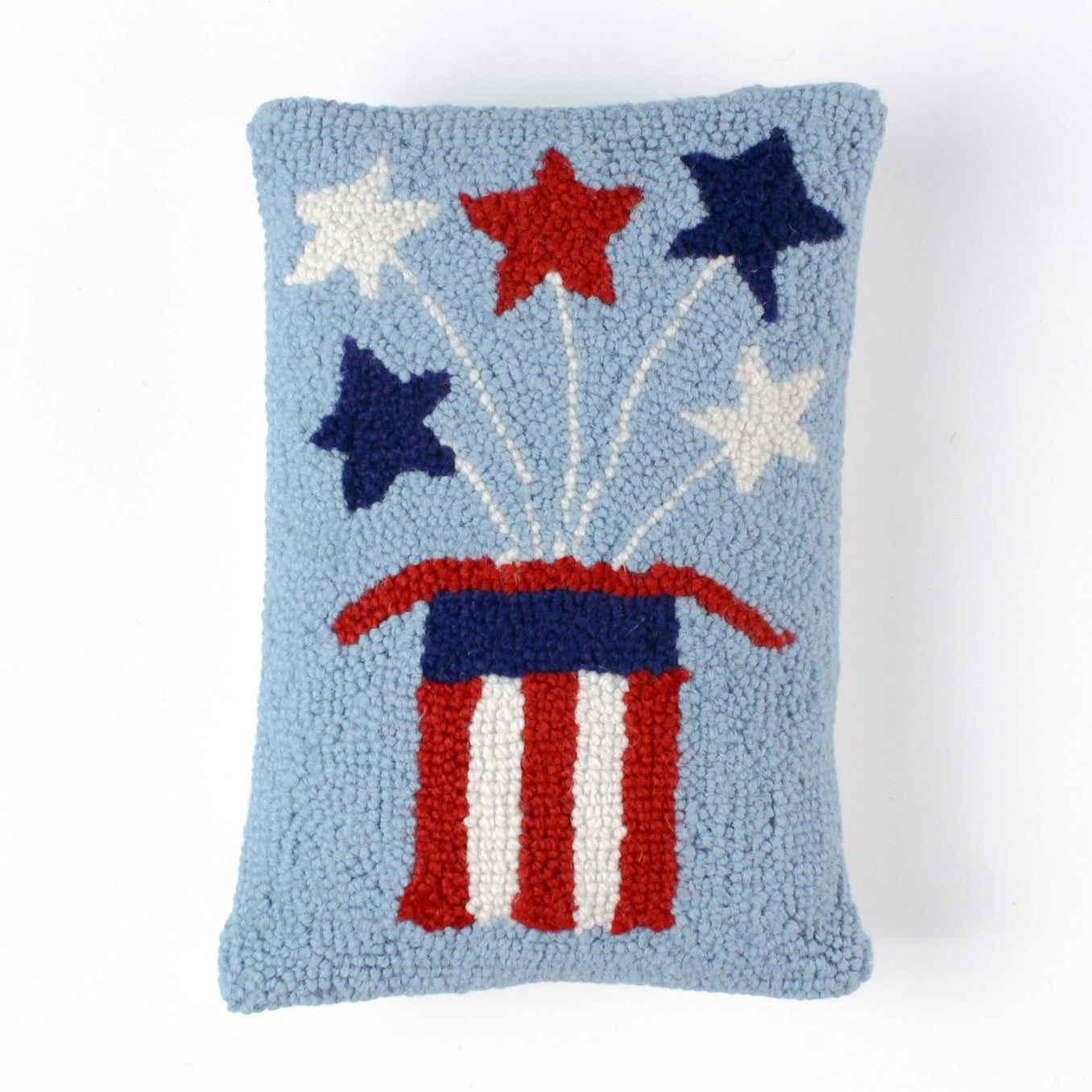 Rectangular light blue pillow featuring a red, white, and blue Uncle Sam hat with stars bursting from the top, symbolizing a patriotic USA theme.