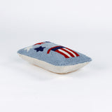 Rectangular light blue pillow featuring a red, white, and blue Uncle Sam hat with stars bursting from the top, symbolizing a patriotic USA theme.
