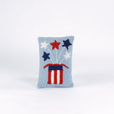 Rectangular light blue pillow featuring a red, white, and blue Uncle Sam hat with stars bursting from the top, symbolizing a patriotic USA theme.