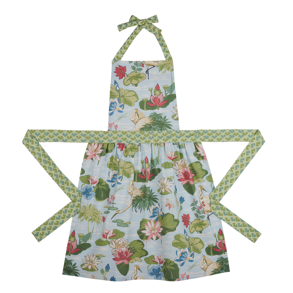 a green, pink and blue floral apron featuring the Meadow bluc water lilies pattern fabric from madcap cottage