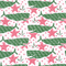 a white fabric with green whales and pink stars. 