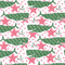 white wallpaper with a repeating green whale and pink star motif. 