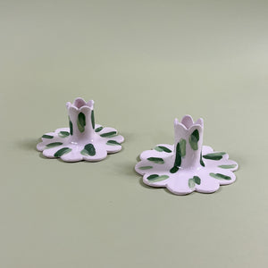 a pair of madcap cottage ceramic candle holders with scalloped edges and a green brushstroke print